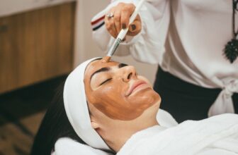 A collection of skincare tools and products arranged aesthetically, showcasing items like facial rollers, serums, and moisturizers on a clean surface.